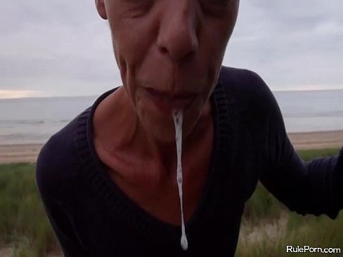 Cock blowing at the beach