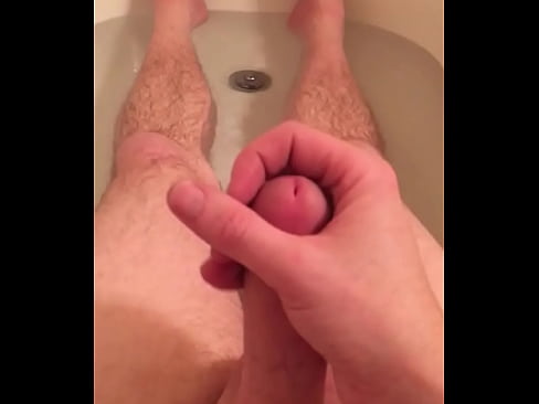 Having fun stroking in bath