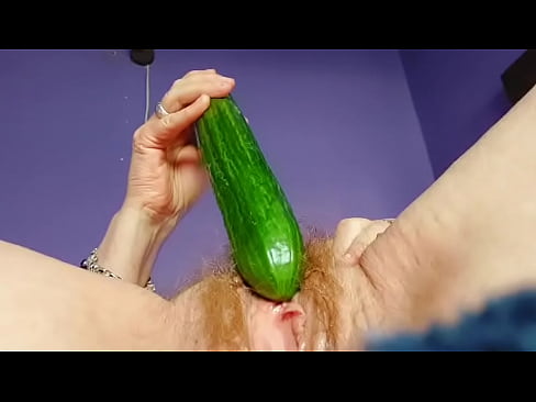 Granny fucks hairy pussy with cucumber