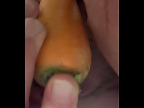 Tying to stick the whole carrot in
