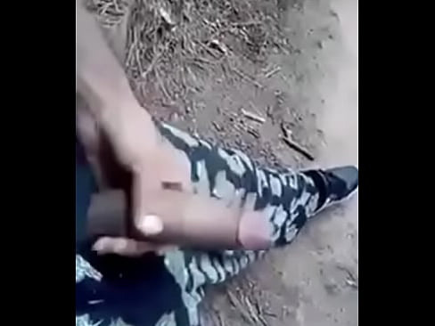 Dude strokes his dick in forest