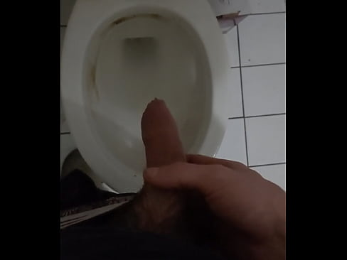 Boy taking a pee in toilet
