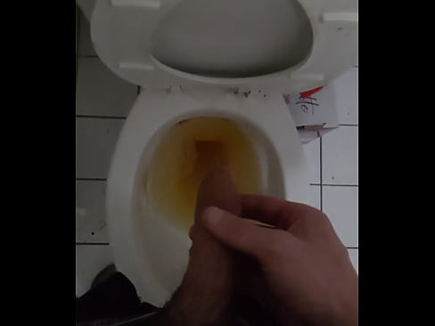 Boy taking a pee in toilet