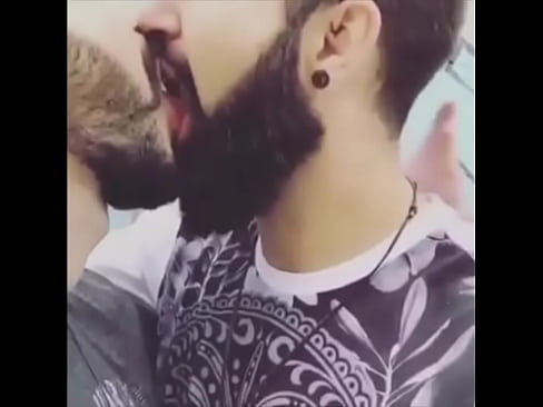 Two gay male kissing each other with full bearn on | gaylavida.com