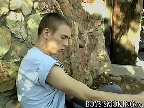 Handsome youngster strokes and smokes