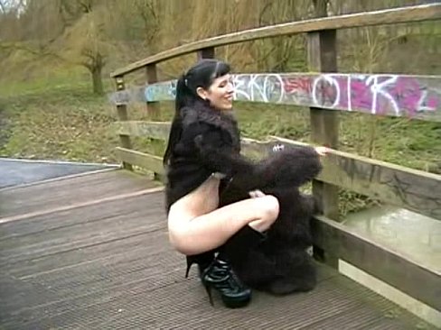 Goth Babe in Furry Coat Pisses Outdoors 1