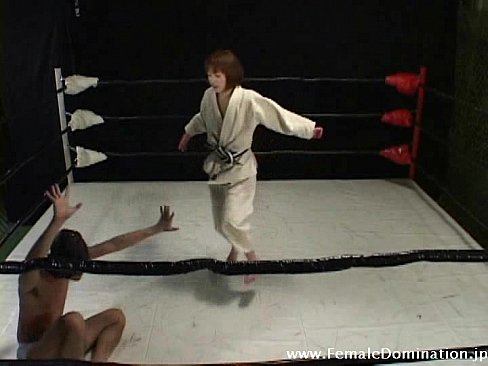 Collared slave is totally b. up by a domina in the ring