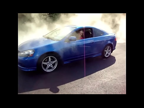 Young woman blows engine In Acura RSX twhile her two friends stand by and watch