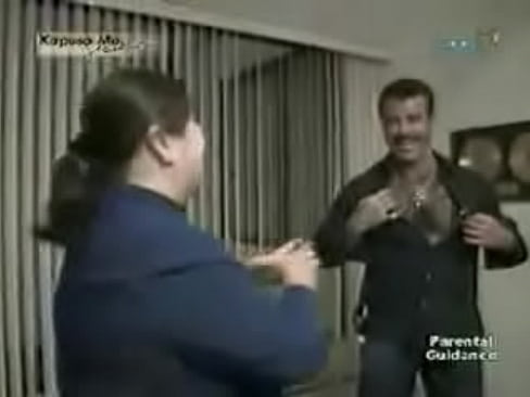 Eduardo Capetillo during a interview, open his shirt