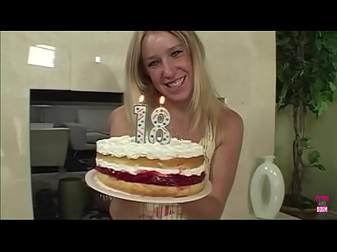 A stunning blonde woman, adorned with a birthday gift, delivers an exceptional blowjob to her partner