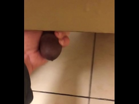 Jerking a big black cock in mall restroom