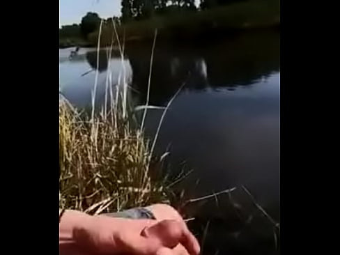 cute guy shooting his load into a river