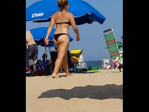 Candid on this little slut at the beach