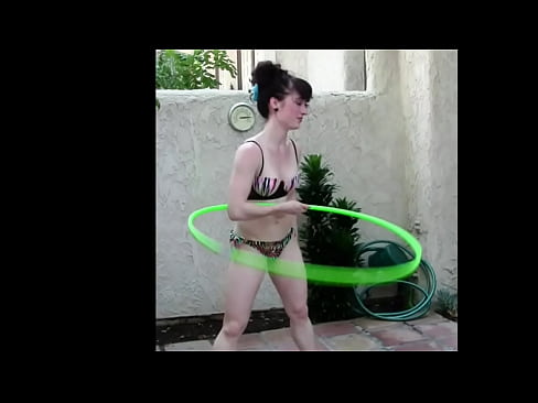 Fitness Girl  puts her hair up to work the hula hoop in this BTS non-nude bikini play