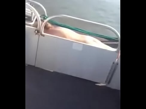 blonde MILF sun bathing Naked on pontoon boat