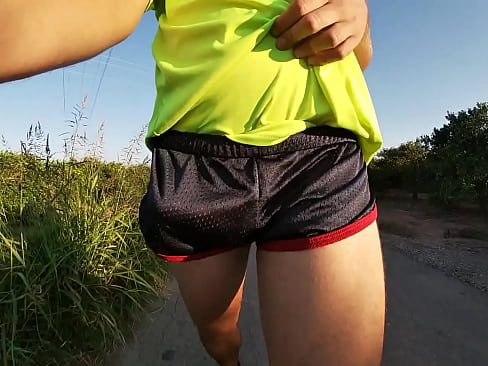 Tight shiny sport shorts bulging routine (freeballing in a public place)