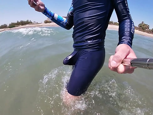 Surfer gets erect in his lycra for the pleasure of the people