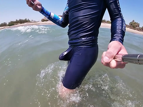 Surfer gets erect in his lycra for the pleasure of the people