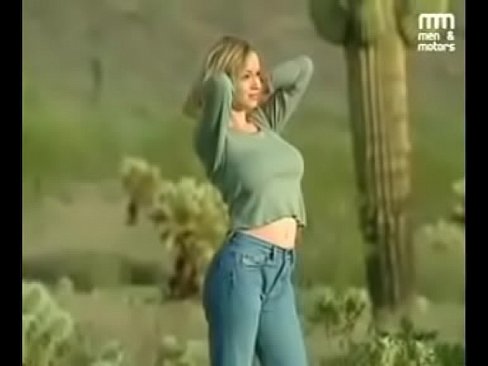Hot blonde model with big tits shooting topless in the desert