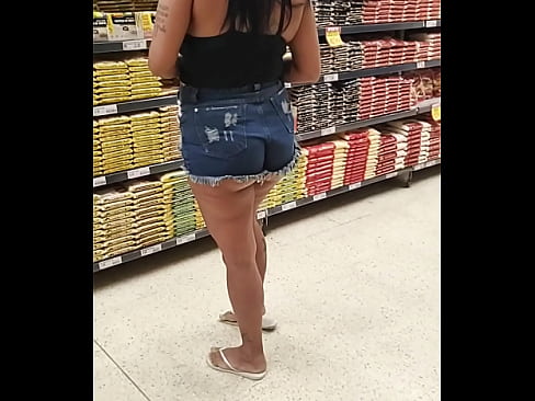 Hot wife in short shorts showing her huge ass at the market. Hot wife, cuckold.