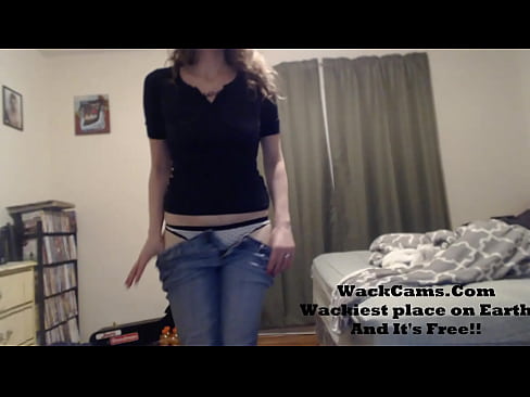 Brunette Stripping out of Jeans and T-shirt
