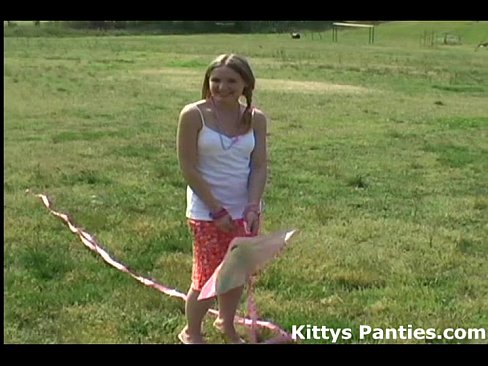 Innocent teen Kitty flying her kite