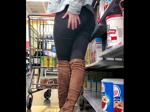 Sexy teen rubs her booty in store