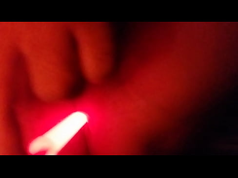 Anal masturbation with a light stick in the dark