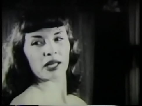 Hottie with bangs stripping on camera in vintage film 50s