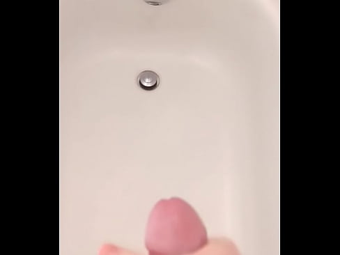 White dude shoots a load of cum in his bathtub