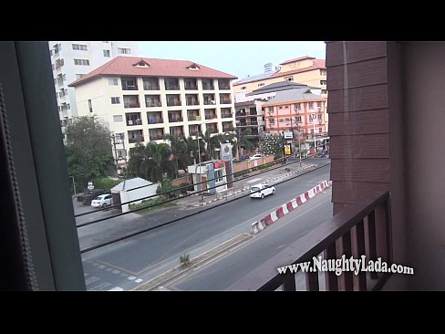 Nude in public on the balcony overlooking road.