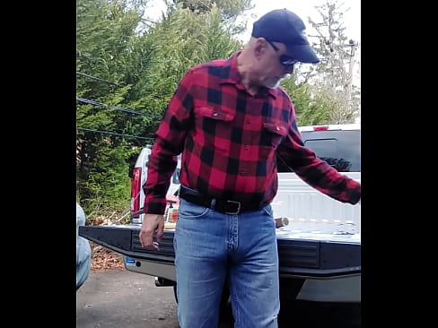 Lumberjack type guy finishes up after cutting wood