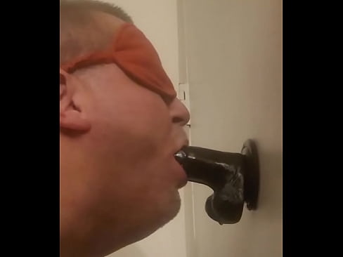 Submissive throat fucks himself with dildo