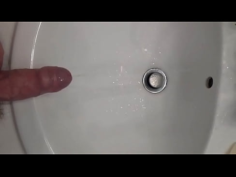 Peeing with hard cock