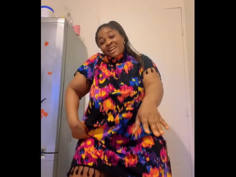 Afro Getty showing thighs while dancing in flower dress