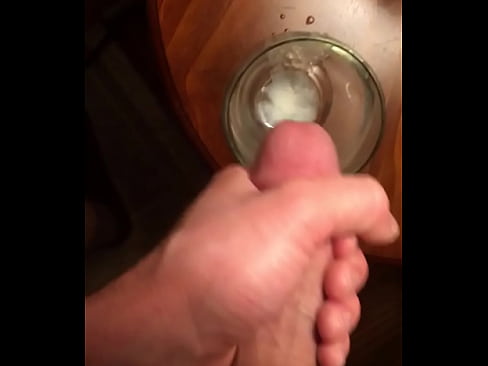 Close up cumshot in glass