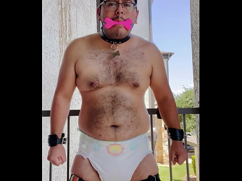 Diaper boy tied up to the balcony