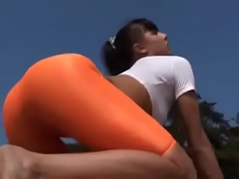 Sexy Girl In Orange Spandex Shorts