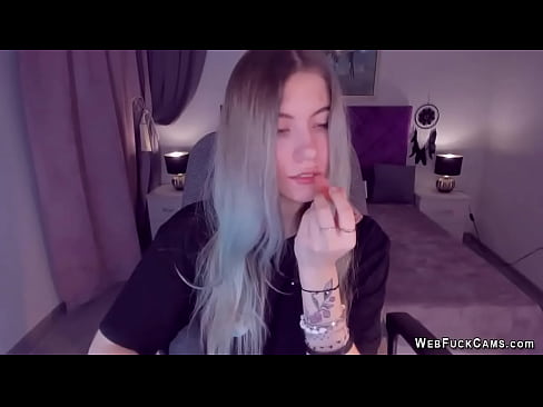 Long haired blonde amateur Ukrainian teen SimaDark in black outfit chats on live solo webcam show then strips and shows tattoos and natural tits