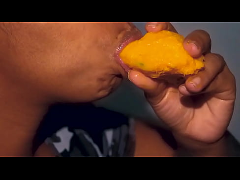 Lustful latina eating a mango the sexy way