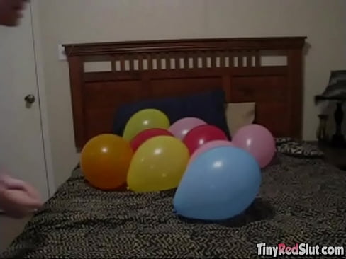 Sexy redhead teen playing with balloons and having a wonderful fetish time