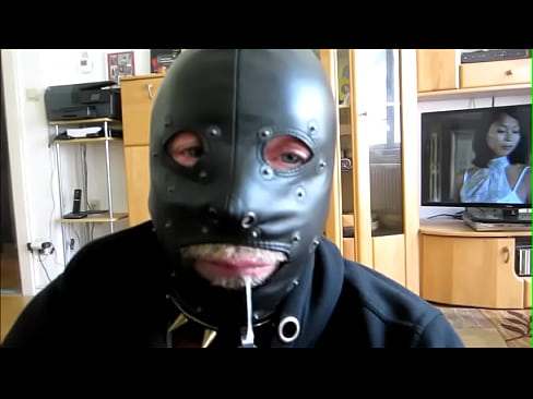 Naughty slave with leather mask swallows  sperm