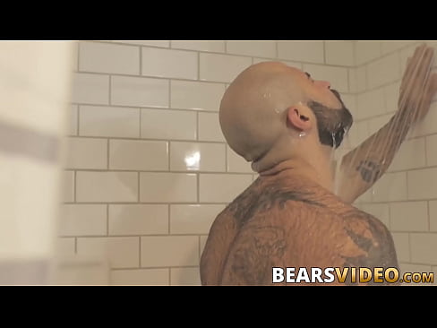 Hairy hunk jerks off solo in the shower