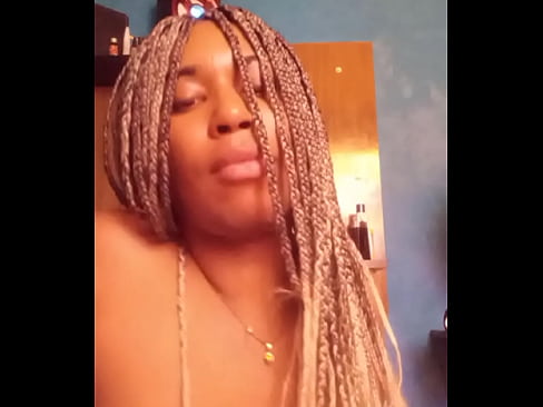 black trans woman using large dildo.