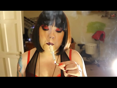 Chubby Mistress Smoking A Gauloise Cigarette With A Holder