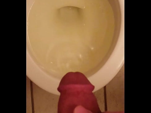 Pissing intermittently through a nice hard erection.