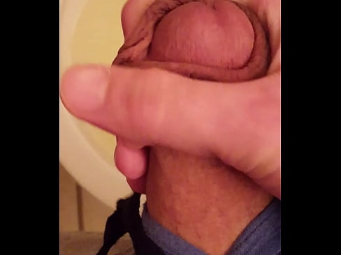 Pissing intermittently through a nice hard erection.