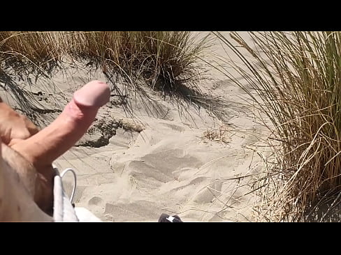 soaking up the sun and stroking my cock at the beach