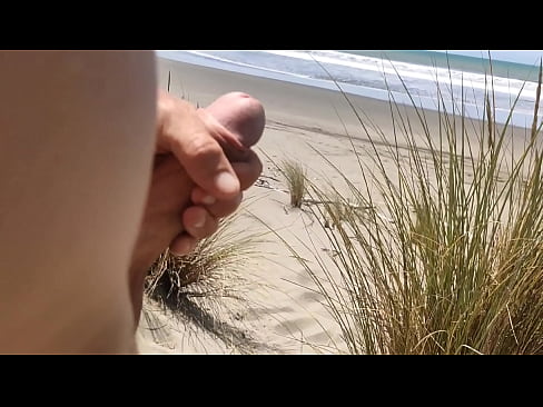 soaking up the sun and stroking my cock at the beach