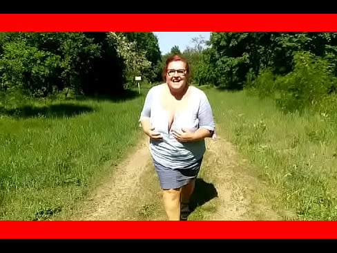 Kathy pulls out her huge tits in nature